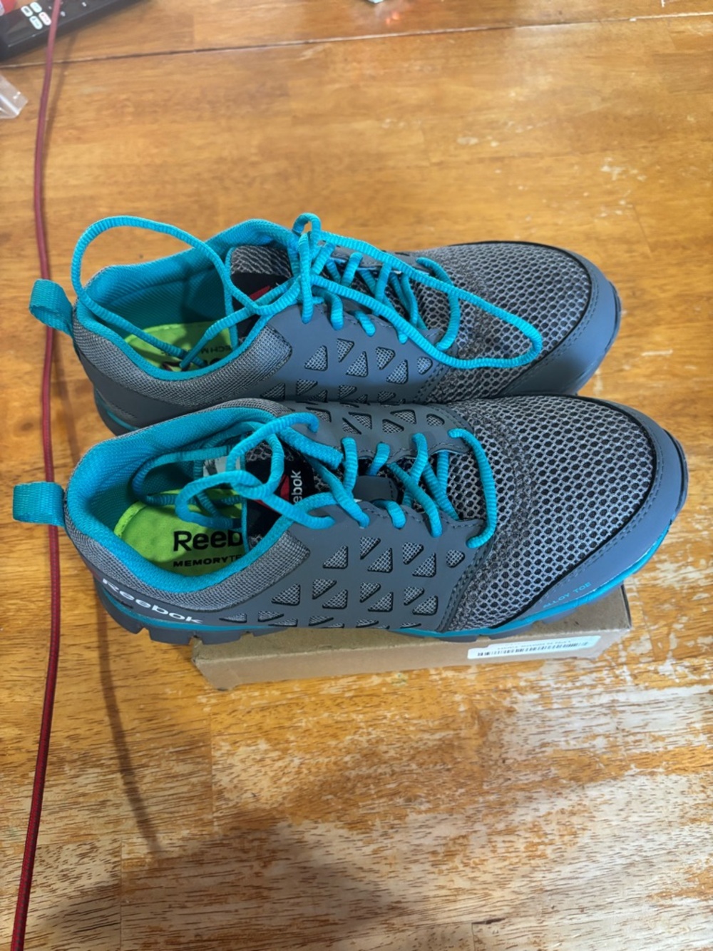 Reebok Gray steel toed Sneakers with Teal Accents